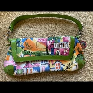 EUC Sak canvas print/green leather convertible clutch